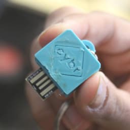 a USB rubber ducky consisting of an Arduino board encased in a light blue 3D-printed case